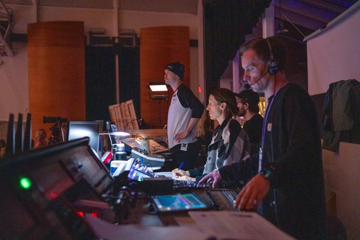 Technical crew volunteers managing production equipment during an event