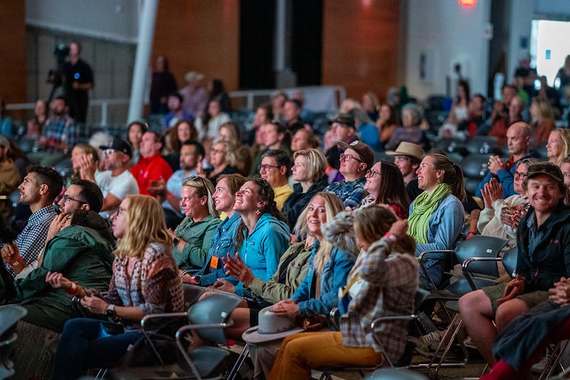 Engaged audience members listening to inspiring talks at TEDxBreckenridge