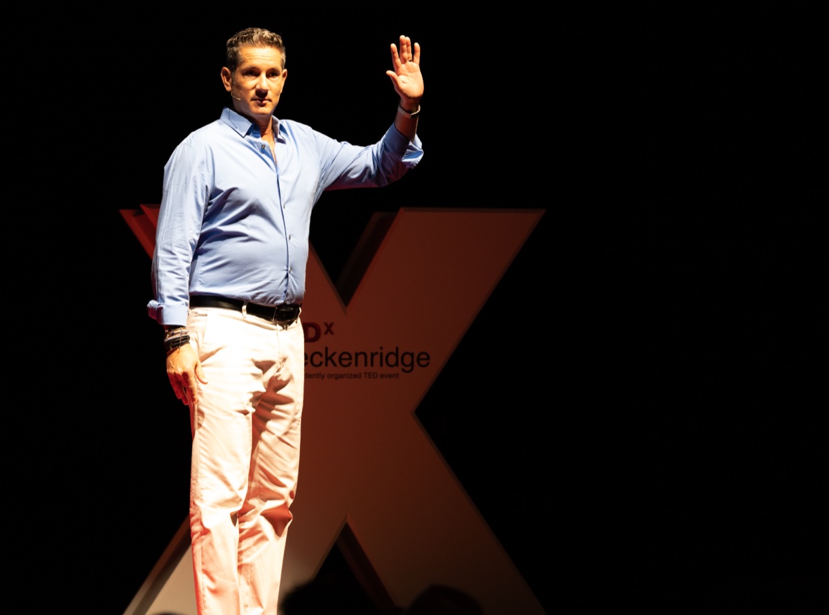 TEDxBreckenridge speaker engaging dynamically with the audience during their talk